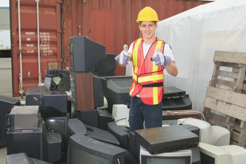 Business office with clutter being cleared for waste removal