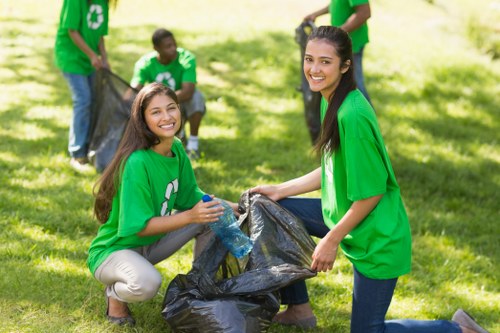Crew sorting household junk before loading for recycling