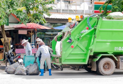 Professional waste removal team handling large debris